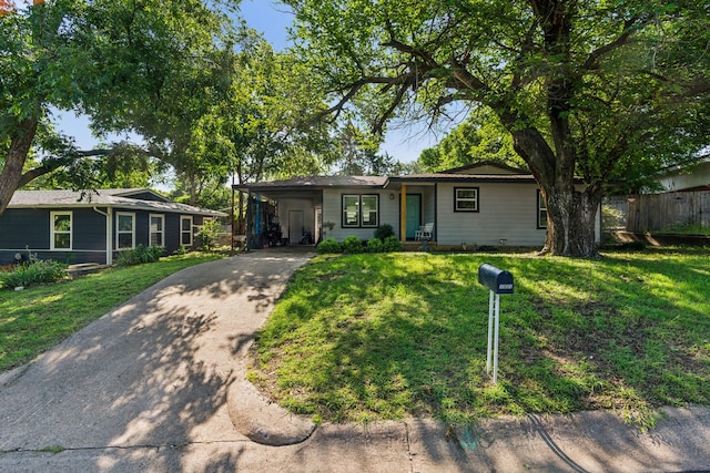 1321 S Lamar St, Weatherford, TX 76086 - ranch-style house with concrete driveway and a carport