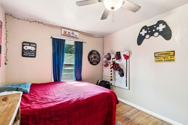 1321 S Lamar St, Weatherford, TX 76086 - bedroom featuring wood finished floors and a ceiling fan