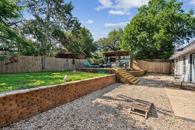 1321 S Lamar St, Weatherford, TX 76086 - fenced backyard with a patio