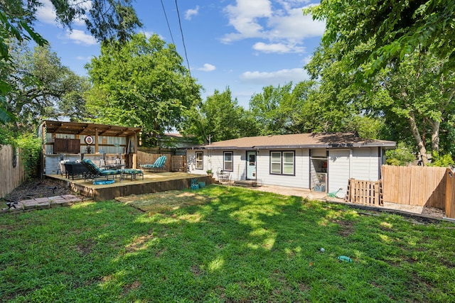 1321 S Lamar St, Weatherford, TX 76086 - back of property featuring a patio and a fenced backyard