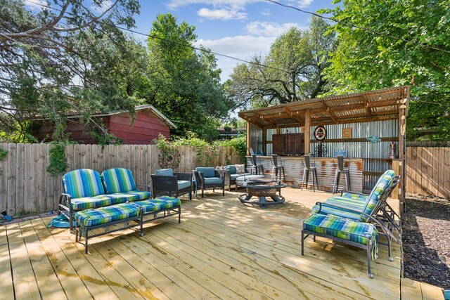 1321 S Lamar St, Weatherford, TX 76086 - wooden terrace with an outdoor living space with a fire pit and a fenced backyard