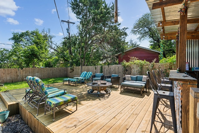 1321 S Lamar St, Weatherford, TX 76086 - deck with a fenced backyard and an outdoor living space with a fire pit