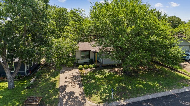 1321 S Lamar St, Weatherford, TX 76086 - view of property hidden behind natural elements featuring a front yard