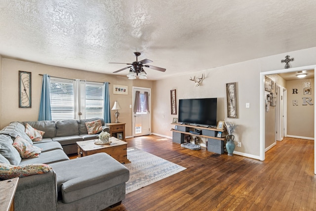 1321 S Lamar St, Weatherford, TX 76086 - living room featuring hardwood / wood-style floors, a ceiling fan, and a textured ceiling