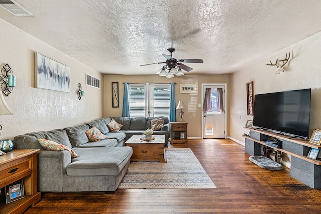 1321 S Lamar St, Weatherford, TX 76086 - living area with a textured ceiling, wood finished floors, and a ceiling fan