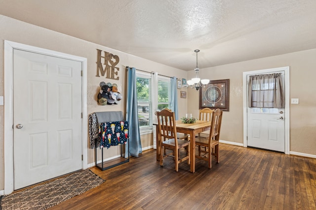 1321 S Lamar St, Weatherford, TX 76086 - dining room with a chandelier, dark wood-style flooring, and a textured ceiling