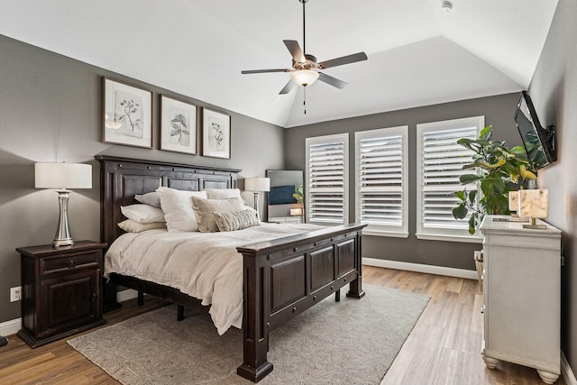 7709 Waterside, The Colony, TX 75056 - bedroom with light wood-type flooring, vaulted ceiling, and ceiling fan