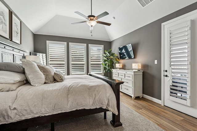 7709 Waterside, The Colony, TX 75056 - bedroom featuring lofted ceiling, wood finished floors, and ceiling fan