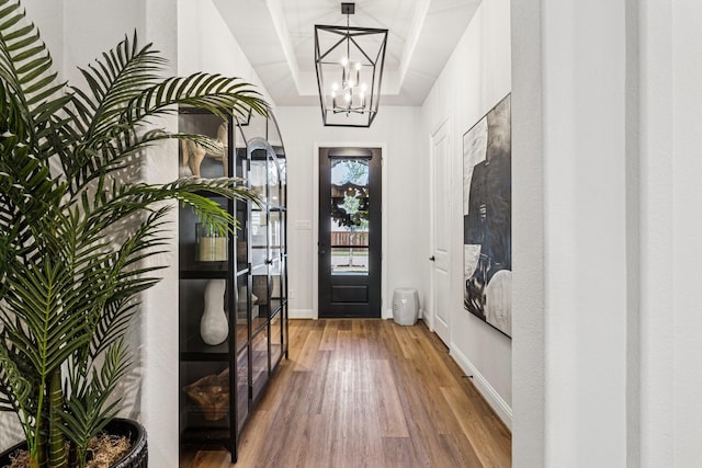 7709 Waterside, The Colony, TX 75056 - entrance foyer with a chandelier, wood finished floors, and a tray ceiling