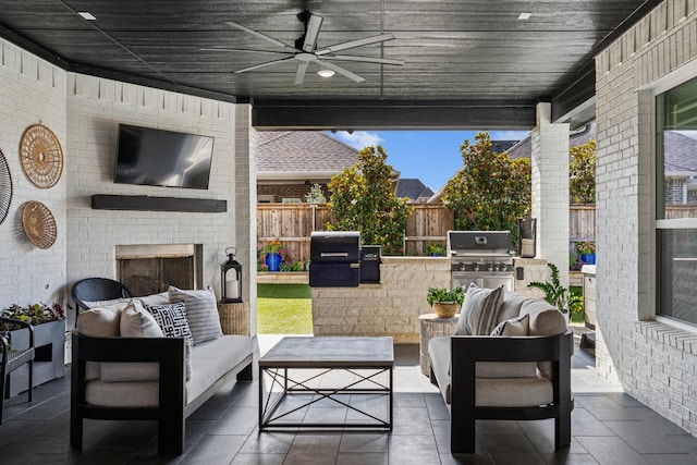 7709 Waterside, The Colony, TX 75056 - view of patio featuring exterior kitchen, an outdoor living space with a fireplace, and ceiling fan