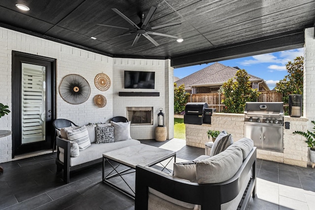 7709 Waterside, The Colony, TX 75056 - view of patio / terrace featuring area for grilling, an outdoor living space with a fireplace, and a ceiling fan
