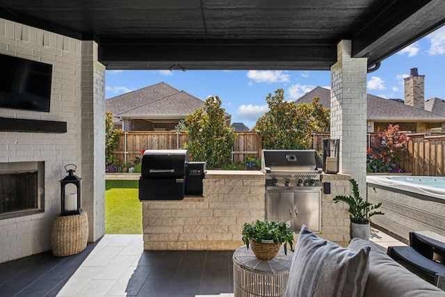 7709 Waterside, The Colony, TX 75056 - fenced backyard with exterior kitchen, a patio area, and an outdoor living space