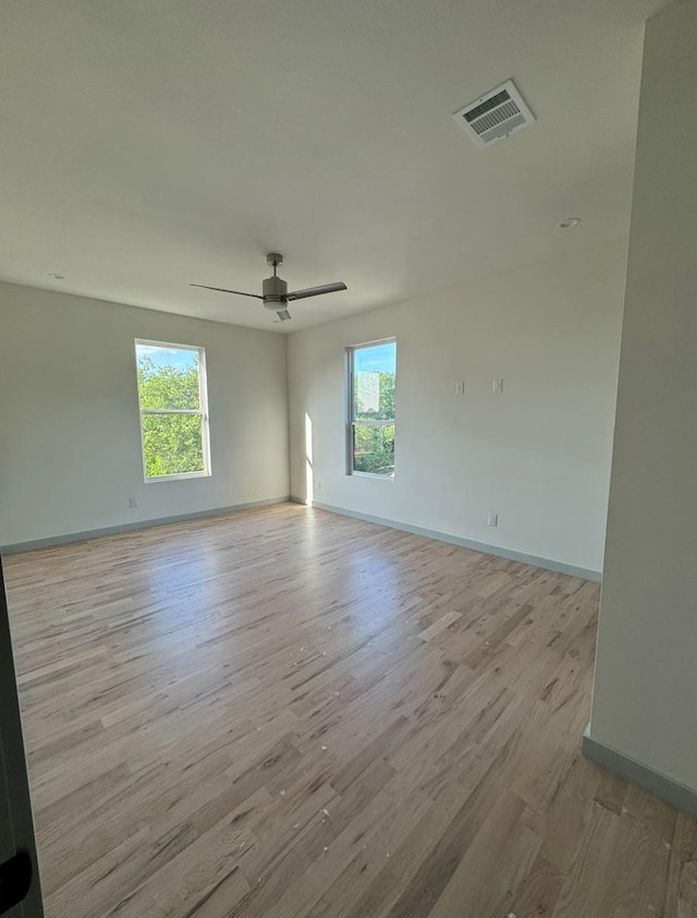 906 S Ewing Ave, Dallas, TX 75203 - spare room with a ceiling fan and wood finished floors