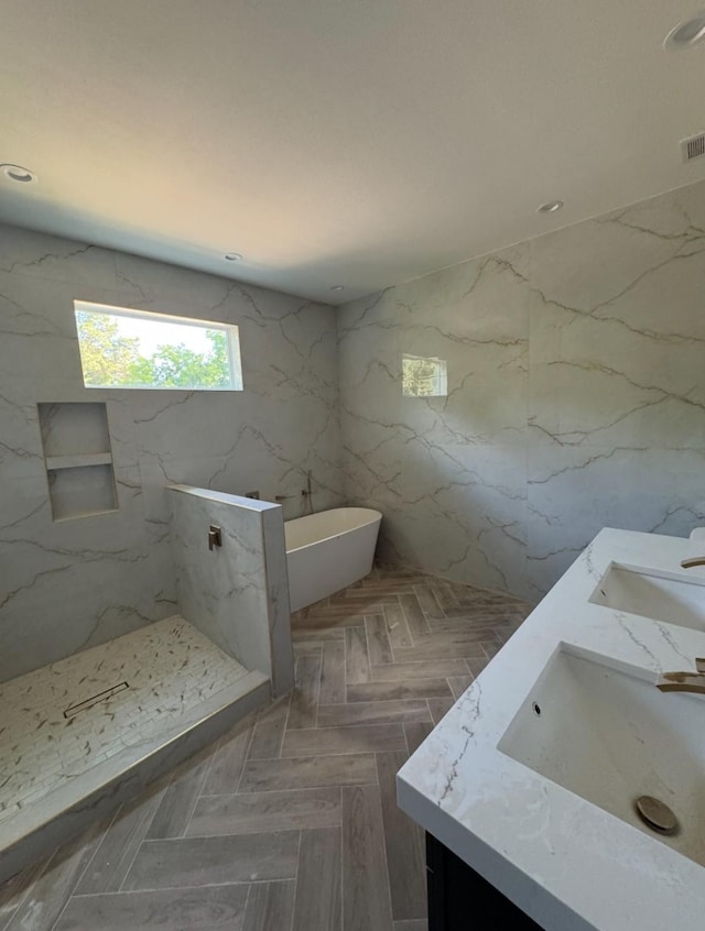 908 S Ewing Ave, Dallas, TX 75203 - full bath featuring double vanity, a freestanding tub, and a marble finish shower