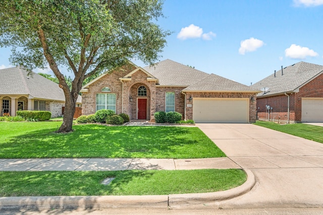 103 Deer Ct, Mansfield, TX 76063 - traditional-style house featuring a garage, driveway, a front lawn, brick siding, and roof with shingles
