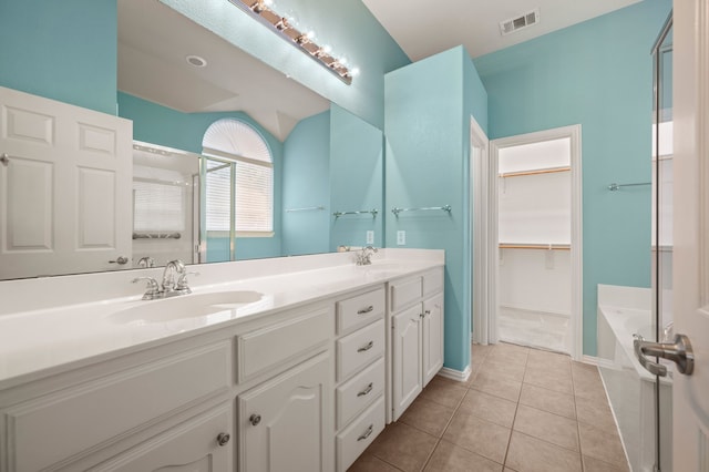 103 Deer Ct, Mansfield, TX 76063 - full bath with double vanity, a garden tub, tile patterned floors, an enclosed shower, and a walk in closet