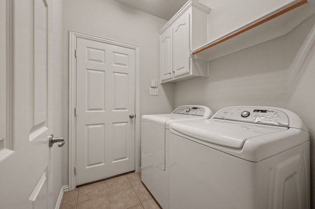 103 Deer Ct, Mansfield, TX 76063 - laundry room with independent washer and dryer, cabinet space, and light tile patterned flooring
