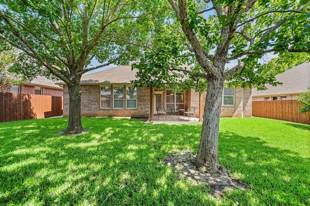 103 Deer Ct, Mansfield, TX 76063 - rear view of property with brick siding, a fenced backyard, a patio area, and a shingled roof