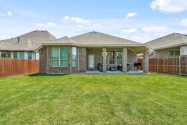14840 Nightmist Rd, Aledo, TX 76008 - back of property with a fenced backyard, a patio, brick siding, and a shingled roof