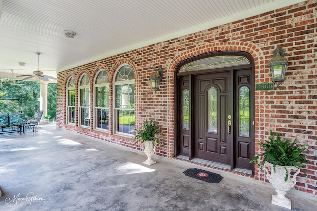 3669 Fountainbleau Rd, Keithville, LA 71047 - property entrance with brick siding, covered porch, and a ceiling fan