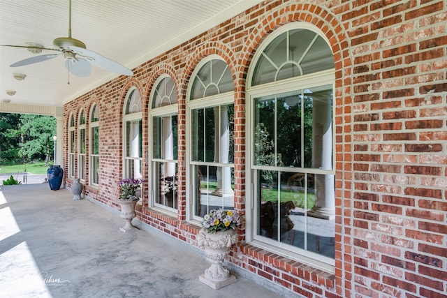 3669 Fountainbleau Rd, Keithville, LA 71047 - property entrance featuring brick siding, a ceiling fan, and covered porch