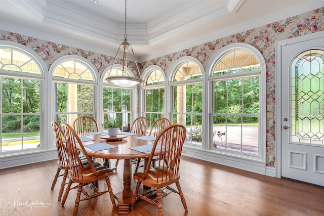 3669 Fountainbleau Rd, Keithville, LA 71047 - dining area featuring a tray ceiling, plenty of natural light, ornamental molding, wood finished floors, and wallpapered walls