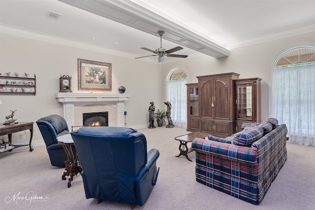 3669 Fountainbleau Rd, Keithville, LA 71047 - carpeted living area featuring ornamental molding, a fireplace, a ceiling fan, and plenty of natural light
