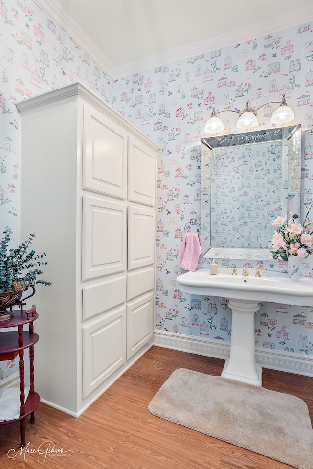 3669 Fountainbleau Rd, Keithville, LA 71047 - bathroom with wallpapered walls, wood finished floors, and crown molding