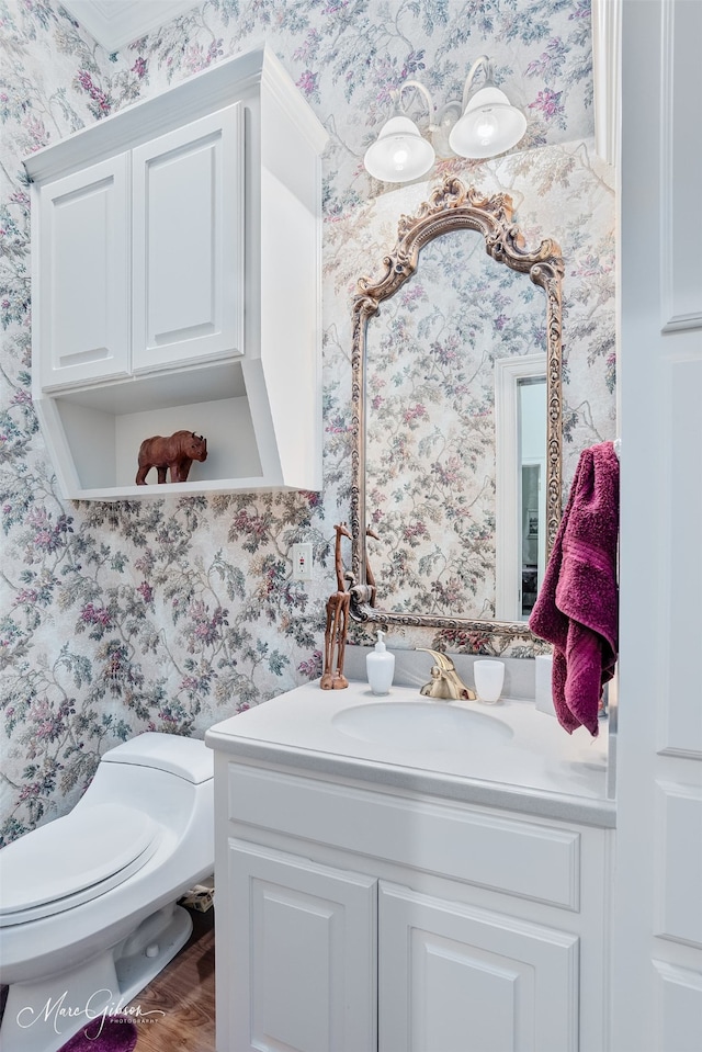 3669 Fountainbleau Rd, Keithville, LA 71047 - half bathroom featuring wallpapered walls, vanity, and wood finished floors