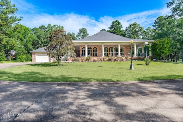 3669 Fountainbleau Rd, Keithville, LA 71047 - ranch-style house with asphalt driveway, a front yard, an attached garage, and brick siding