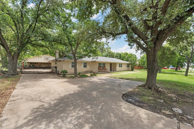 631 N Robinson Dr, Robinson, TX 76706 - ranch-style house with a gate, driveway, and a chimney