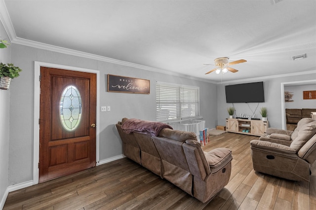 631 N Robinson Dr, Robinson, TX 76706 - living area featuring ornamental molding, ceiling fan, and wood finished floors