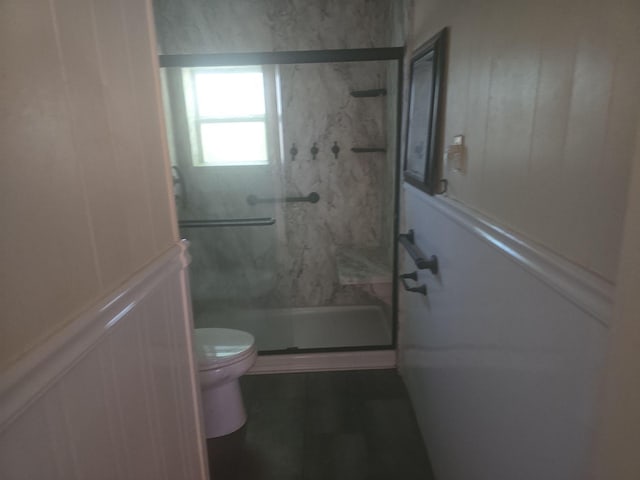 311 Elmo St, Cleburne, TX 76031 - full bathroom with a marble finish shower and a decorative wall