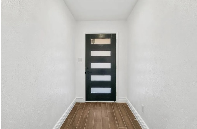 6300 Topaz Way, Plano, TX 75023 - doorway to outside with dark wood-style flooring and baseboards