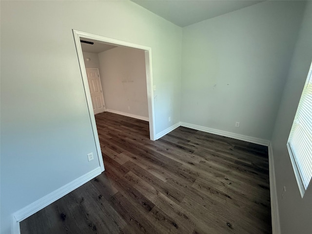3221 Jackson St, Shreveport, LA 71109 - unfurnished room featuring baseboards and dark wood-type flooring