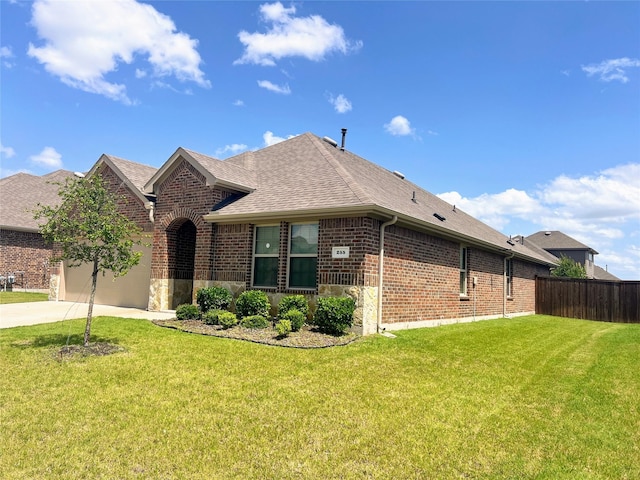 255 Carolina Trce, Fate, TX 75189 - view of front facade featuring brick siding, a shingled roof, concrete driveway, and a garage