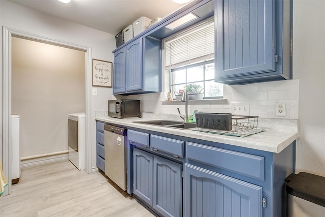 397 Flat Rock Rd, Azle, TX 76020 - kitchen with stainless steel dishwasher, blue cabinetry, and black microwave