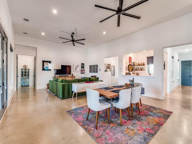 641 Cox Rd, Waxahachie, TX 75167 - dining space with finished concrete flooring, a ceiling fan, and recessed lighting