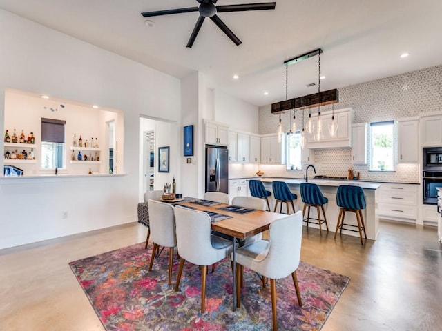 641 Cox Rd, Waxahachie, TX 75167 - dining room with a ceiling fan, concrete floors, and recessed lighting