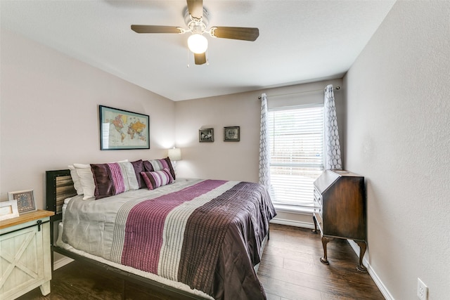 2019 Mcbroom St, Dallas, TX 75212 - bedroom featuring dark wood-type flooring, a ceiling fan, and a textured wall