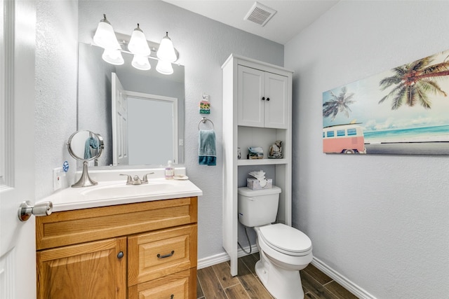 2019 Mcbroom St, Dallas, TX 75212 - bathroom with vanity, wood finished floors, and a textured wall