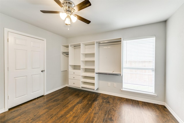 2019 Mcbroom St, Dallas, TX 75212 - unfurnished bedroom featuring multiple windows, dark wood-type flooring, and ceiling fan