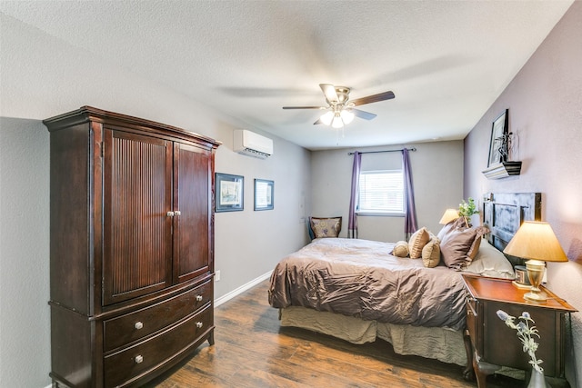 2019 Mcbroom St, Dallas, TX 75212 - bedroom featuring a wall mounted air conditioner, dark wood-style floors, a fireplace, and ceiling fan