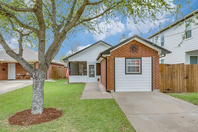 2019 Mcbroom St, Dallas, TX 75212 - view of front of property with brick siding, a chimney, driveway, and a sunroom