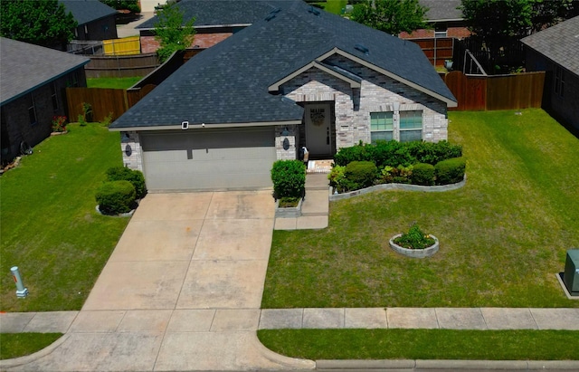 523 Blue Sage Dr, Fate, TX 75087 - view of front of property featuring an attached garage, roof with shingles, concrete driveway, and stone siding