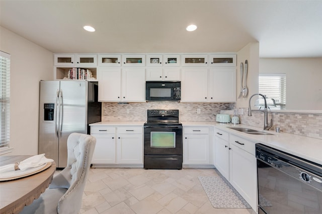 523 Blue Sage Dr, Fate, TX 75087 - kitchen featuring black appliances, white cabinetry, decorative backsplash, light countertops, and recessed lighting