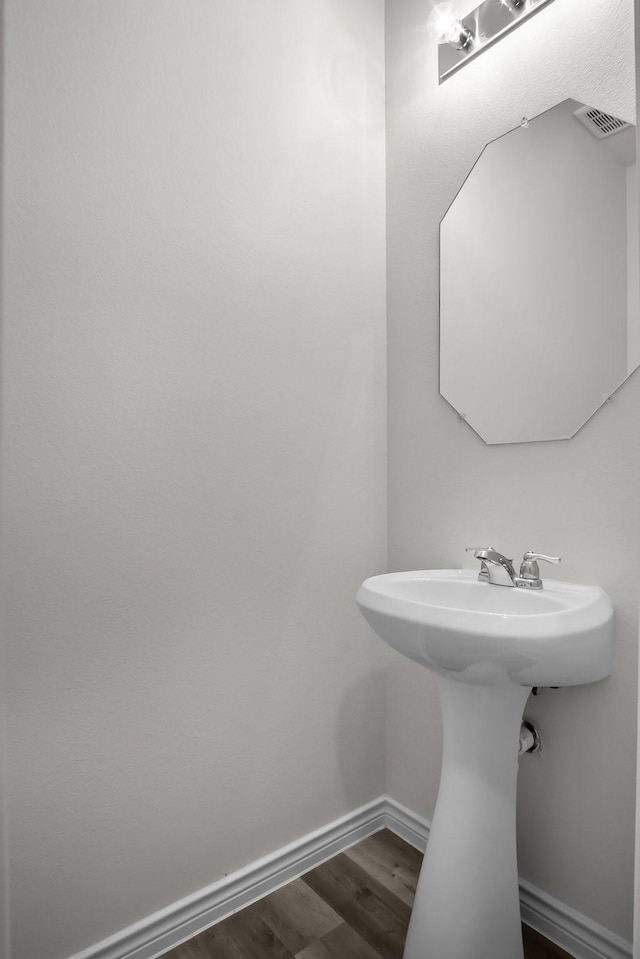 8313 White Pine Dr, Fort Worth, TX 76123 - bathroom featuring wood finished floors and baseboards
