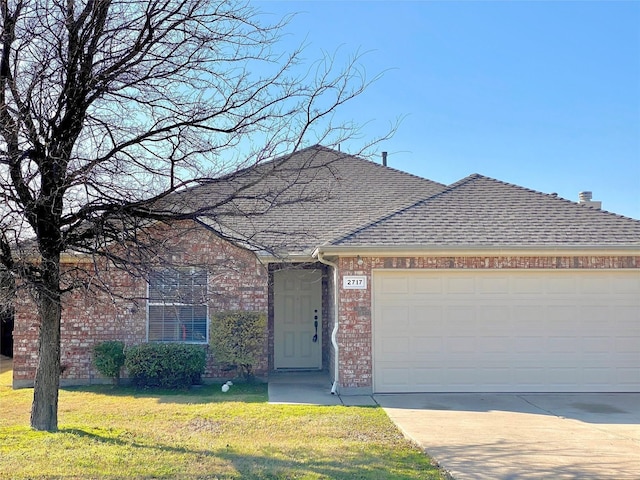 2717 Lumina Dr, Little Elm, TX 75068 - view of front of home with brick siding, driveway, a front yard, and roof with shingles