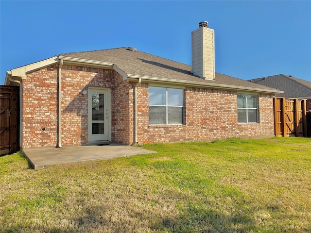 2717 Lumina Dr, Little Elm, TX 75068 - rear view of property featuring a patio area, brick siding, a chimney, and a shingled roof
