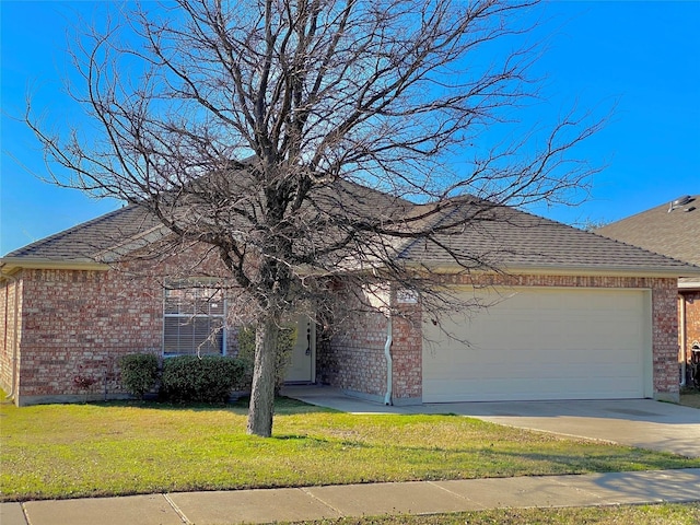 2717 Lumina Dr, Little Elm, TX 75068 - view of front facade with brick siding, a garage, a front yard, concrete driveway, and roof with shingles
